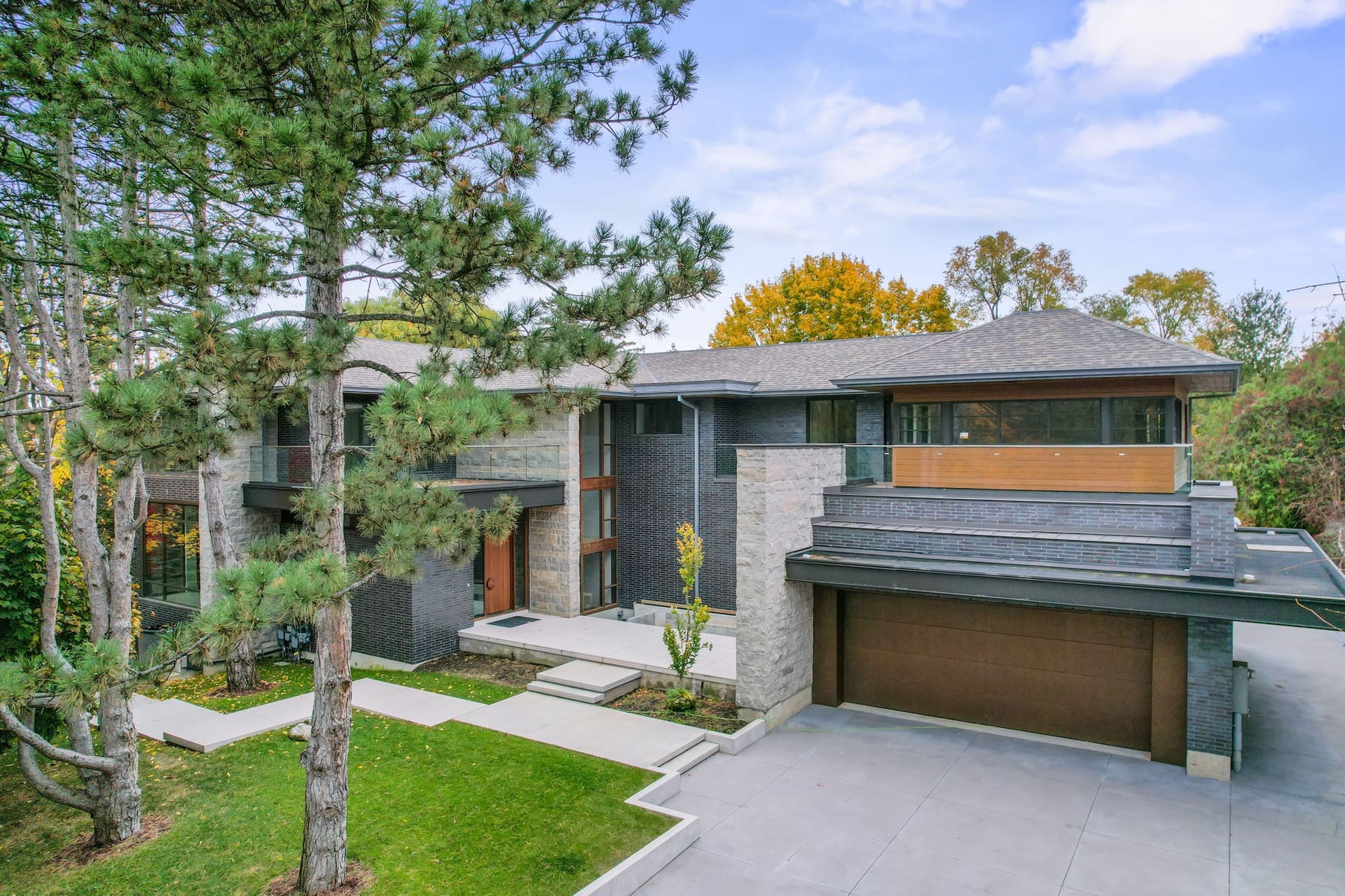 Modern stone and brick exterior of Uniquely Distinguished Property