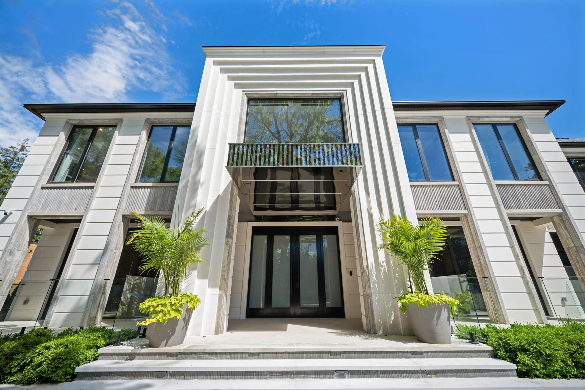White limestone facade and grand entrance of Extraordinary Custom Estate